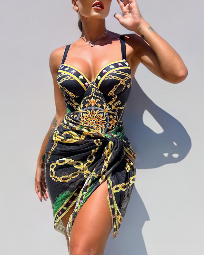 Darius - Push-up swimsuit in one piece with decorative chain details and beach skirt